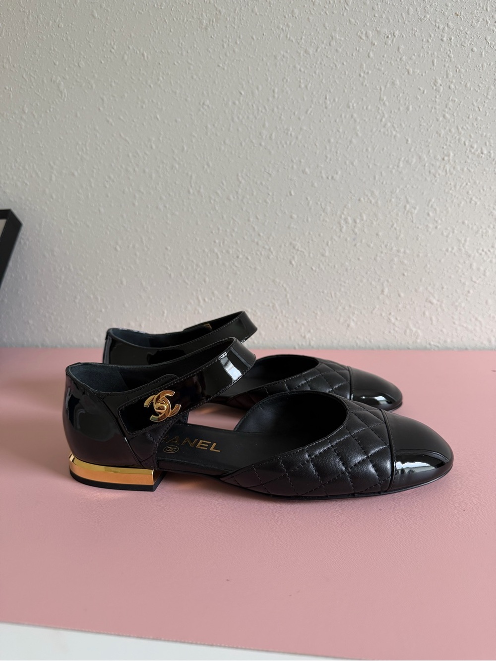 CHANEL Black Quilted Patent Mary Jane Flats with Gold CC Accent